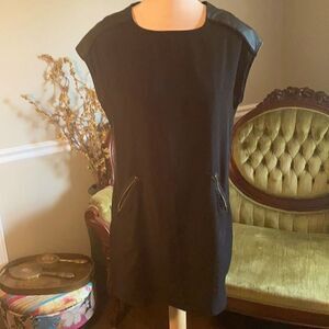 Black dress with faux leather accents. Women’s M.